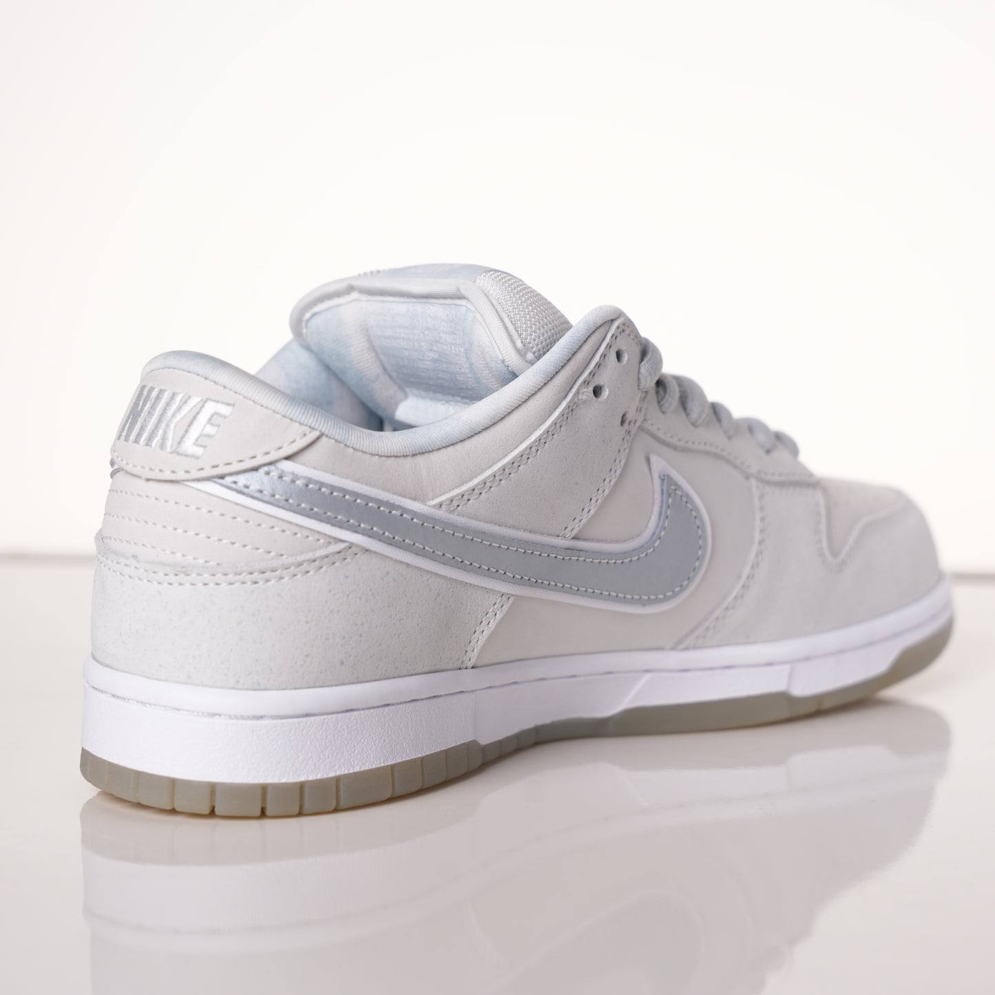 CONCEPTS × Nike Dunk SB Low White Lobster